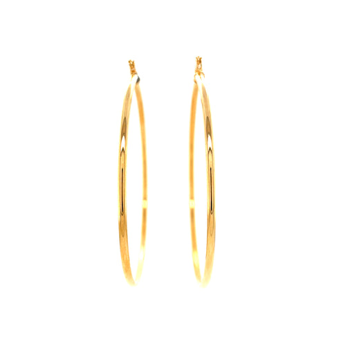 A pair of Big 5.4 cm hoops earrings, made from 14k gold-filled material and measuring 2 mm thick, set against a white background. These statement pieces are smooth and shiny, beautifully reflecting the light.